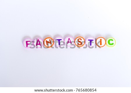Words FANTASTIC arranged by colorful rubber eraser with letter on white background