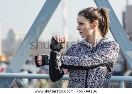 Beautiful Caucasian woman doing stretching exercise with her hands.