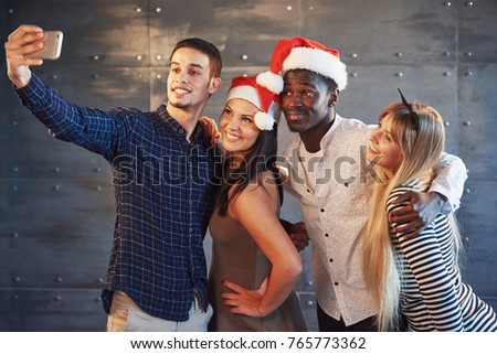 Picture showing group of multiethnic friends celebrating New Year.