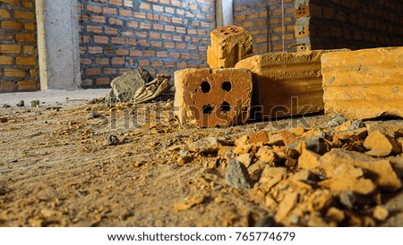 Stone, clay brick fragments. Photos low angle within a construction site. Construction background.
