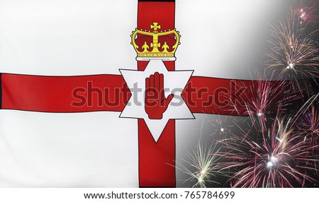 Textile flag of Northern Ireland with firework close up with wind waves in the real fabric
