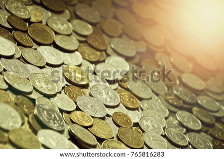 colorful shiny coins in sunlight