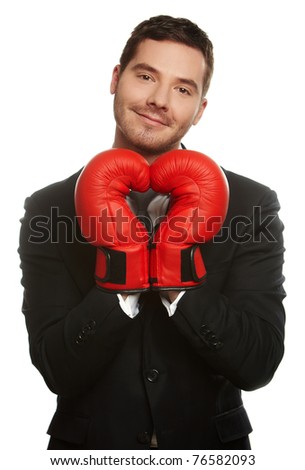 Portrait of a business man wearing boxing-gloves isolated on white