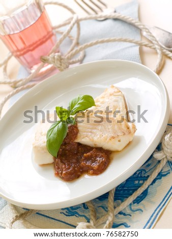 Fish fillet with sauce and basil for your healthy dinner