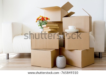 Cardboard boxes - moving to a new house Royalty-Free Stock Photo #765849310