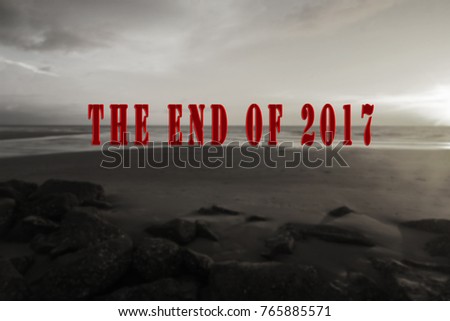 A blur background black and white landscape with red text "The end of 2017". New concept of new year celebration. Inspirational landscape photo for holiday and new year.