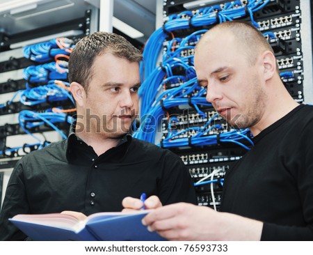 it engineer in network server room solving problems and give help and support