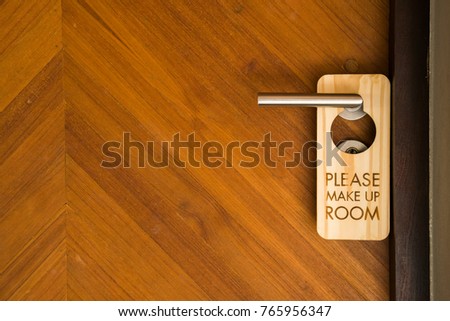 make up room sign hanging on door handle