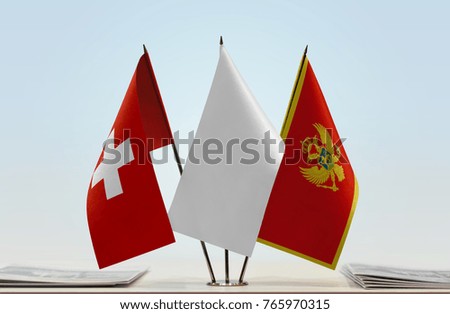 Flags of Switzerland and Montenegro with a white flag in the middle