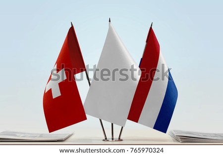 Flags of Switzerland and Netherlands with a white flag in the middle