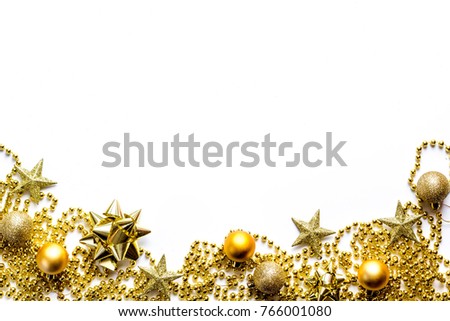 gold New Year's cosmetics for a present to luxury beautiful ladies around golden balls and stars, new year`s decorations on the white background 