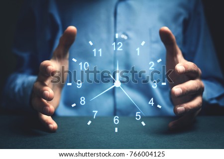 Businessman showing clock. Concept of saving time. Royalty-Free Stock Photo #766004125