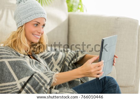 beautiful woman resting at home and surfing on social media