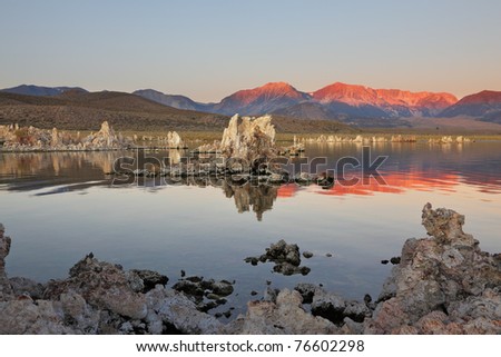Magically beautiful sunrise. Sunrise at Mono Lake in the crater of an ancient extinct volcano. Shallow lake, a multitude of picturesque reefs Tufa