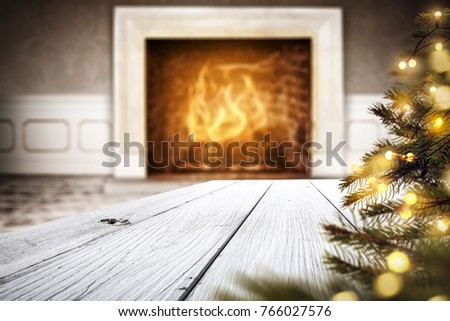 Fireplace and desk of free space for your decoration with christmas tree 