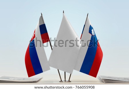 Flags of Slovakia and Slovenia with a white flag in the middle