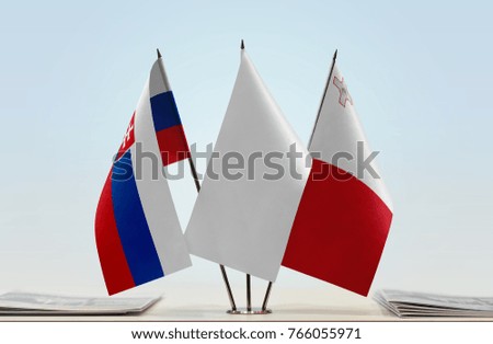 Flags of Slovakia and Malta with a white flag in the middle