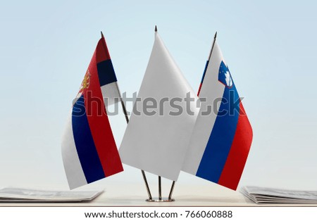 Flags of Serbia and Slovenia with a white flag in the middle