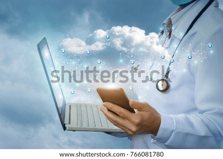 Doctor on mobile and on the laptop running with the cloud data. The concept modern technologies in medicine.