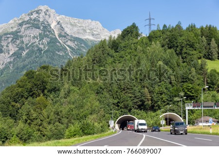 Austrian highway A10 near Hohenwerfen with cars leaving a tunnel through the mountains