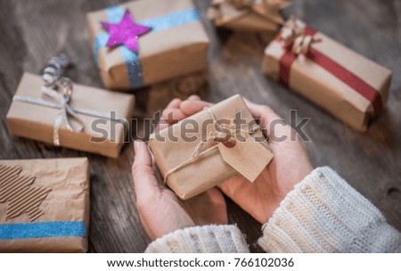 Hands holding beautiful gift box, Christmas or New Year concept