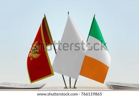 Flags of Montenegro and Ireland with a white flag in the middle
