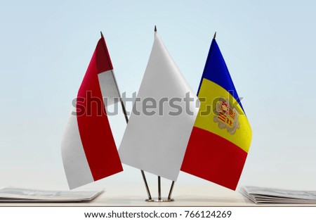 Flags of Monaco and Andorra with a white flag in the middle
