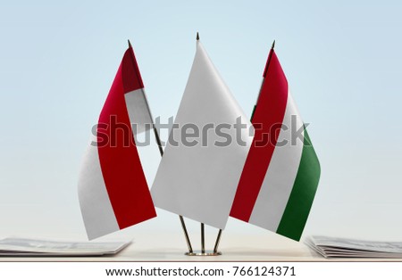 Flags of Monaco and Hungary with a white flag in the middle