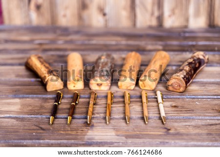 wooden writing pens on grey wooden table