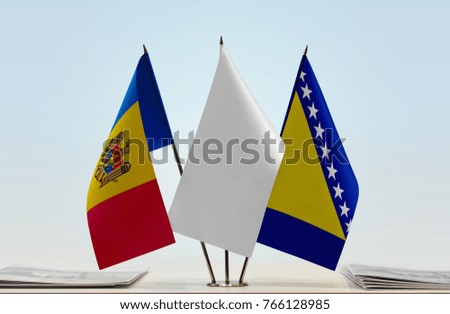Flags of Moldova and Bosnia and Herzegovina with a white flag in the middle