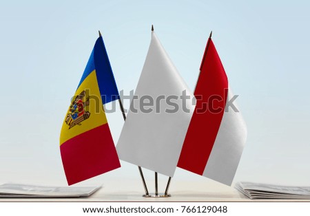 Flags of Moldova and Monaco with a white flag in the middle