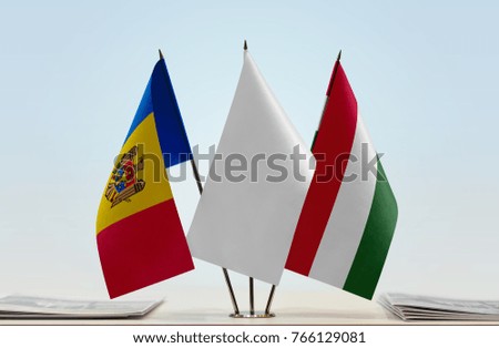 Flags of Moldova and Hungary with a white flag in the middle