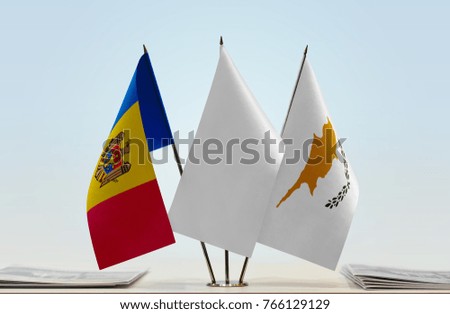 Flags of Moldova and Cyprus with a white flag in the middle