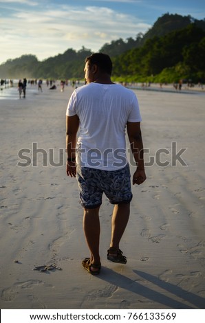 Man Doing a funny Walk on a beach