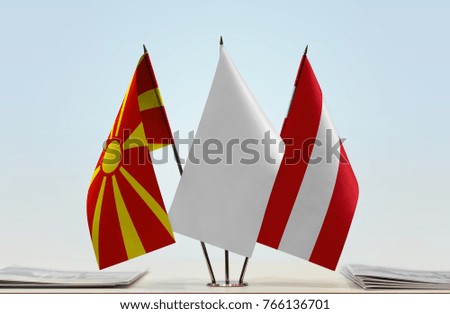 Flags of Macedonia and Austria with a white flag in the middle