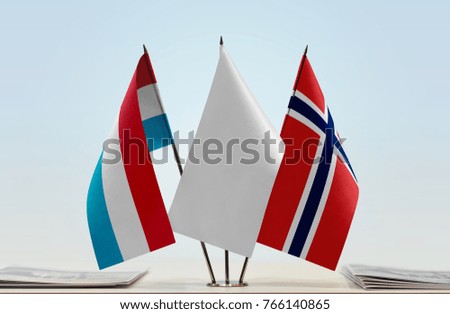 Flags of Luxembourg and Norway with a white flag in the middle