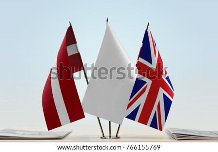 Flags of Latvia and United Kingdom with a white flag in the middle