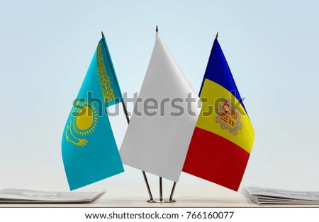 Flags of Kazakhstan and Andorra with a white flag in the middle