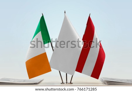 Flags of Ireland and Austria with a white flag in the middle