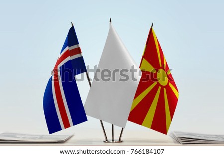 Flags of Iceland and Macedonia with a white flag in the middle