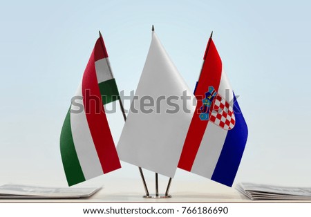 Flags of Hungary and Croatia with a white flag in the middle