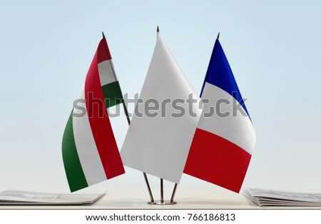 Flags of Hungary and France with a white flag in the middle