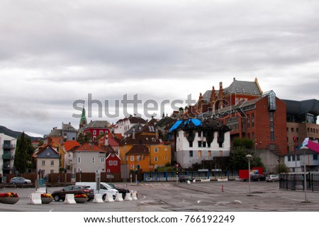 Colorful norwegian cityscape with a burned building
