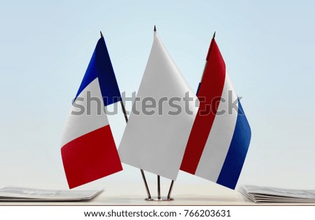 Flags of France and Netherlands with a white flag in the middle