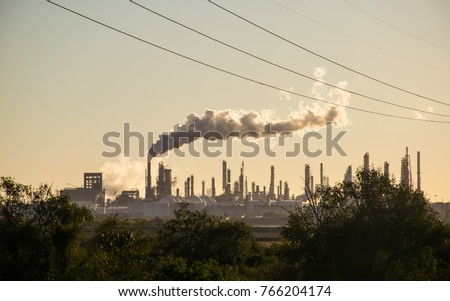 Oil refineries polluting carbon and cancer causing smoke stacks climate change and power plants in Corpus Christi , Texas a massive large refinery Royalty-Free Stock Photo #766204174
