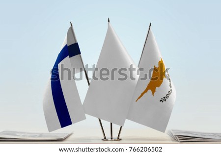 Flags of Finland and Cyprus with a white flag in the middle