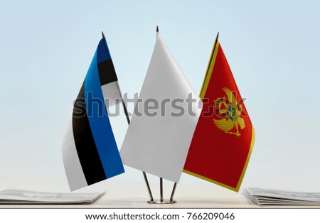 Flags of Estonia and Montenegro with a white flag in the middle