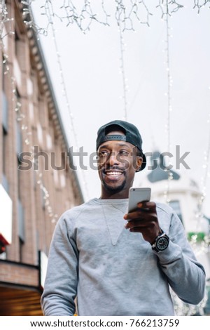 attractive afro american man using the phone
