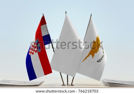 Flags of Croatia and Cyprus with a white flag in the middle