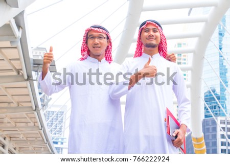 Muslim  Arab man.They are show hands and back in town.group,business,Photo concept Arab man and succeed.
